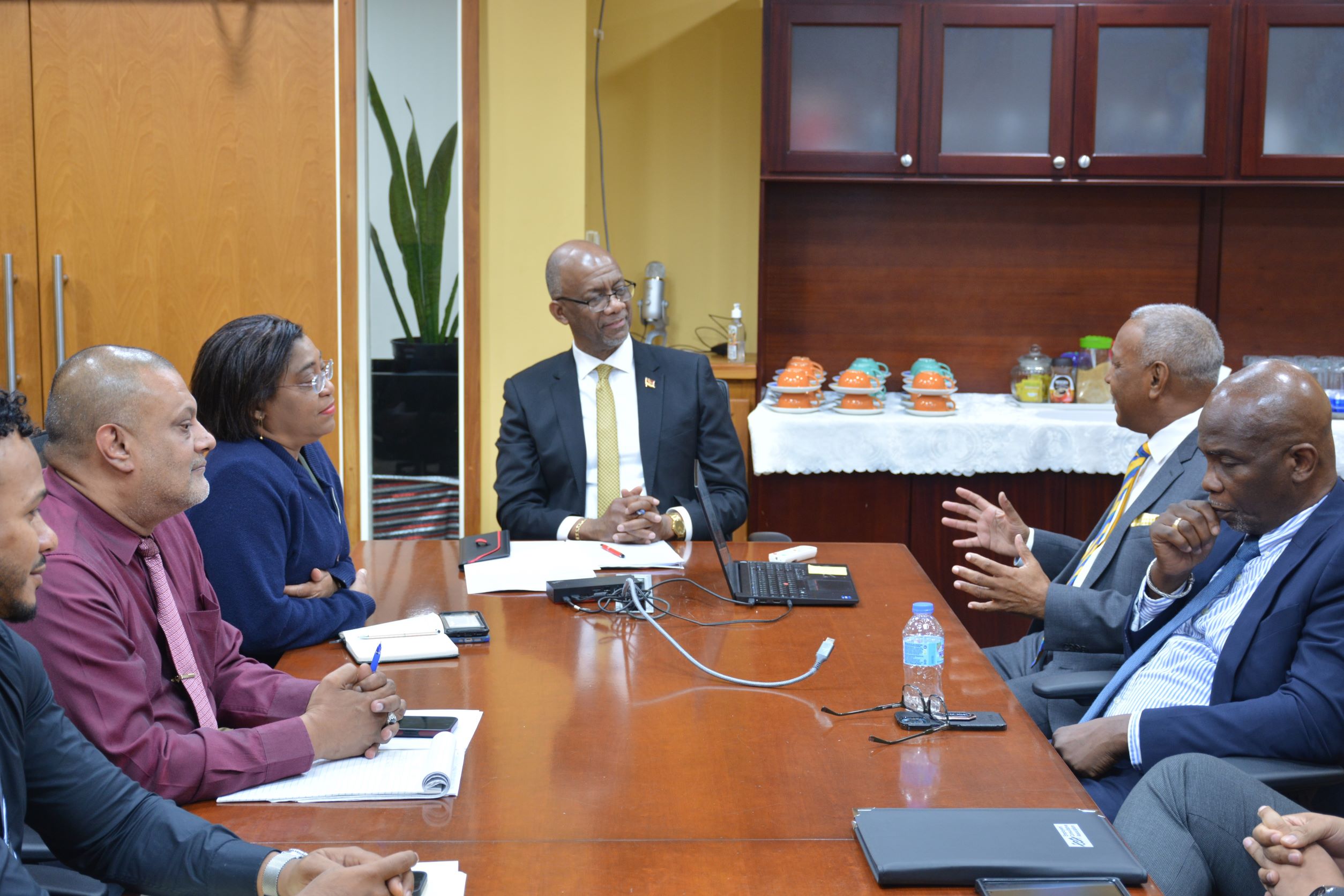 Minister smiling as Mr. Nancoo speaks 01